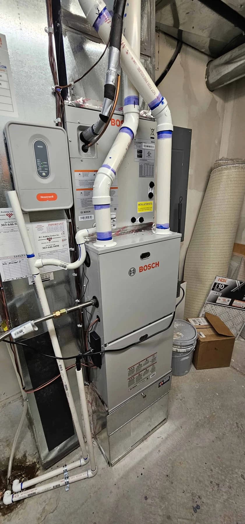 bosch rheem indoor utility room pipes blue tape