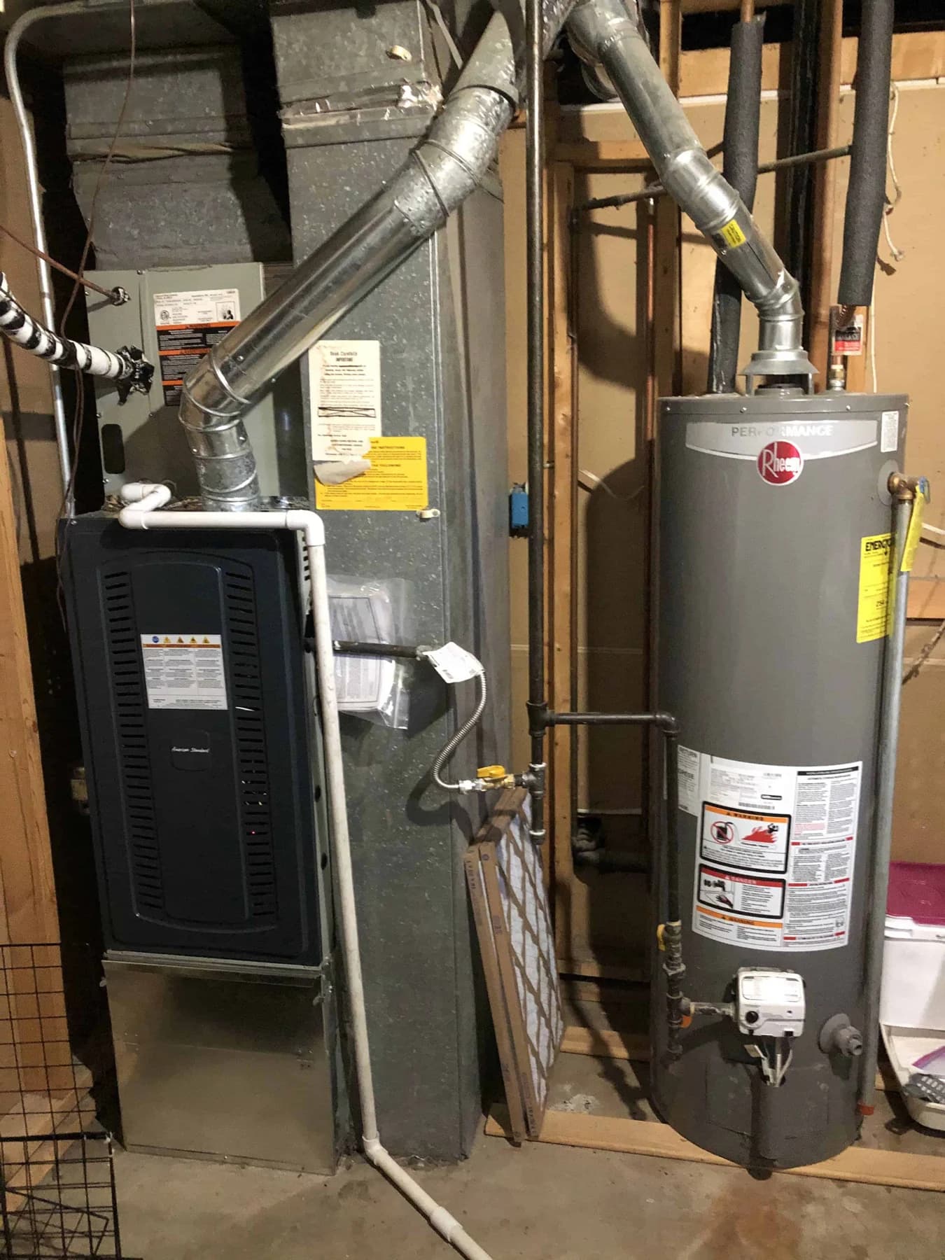 Furnace and water heater sharing a basement mechanical area